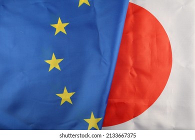 EU and Japan flag close-up - Shutterstock ID 2133667375