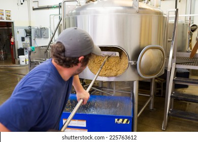EUGENE, OR - JULY 17, 2014: Brewer at Oakshire Brewing making large quantities of Watershed IPA, a staple beer for this craft brewery.