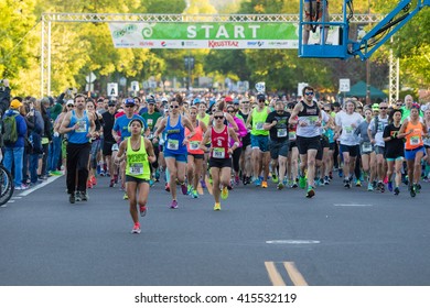 EUGENE, OR - MAY 1, 2016: Runners In A Pack At The Start Of The 2016 Eugene Marathon, A Boston Qualifying Event.