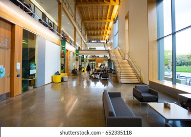 EUGENE, OR - MAY 17, 2017: Students study in the lobby of the Erb Memorial Union building on the University of Oregon campus.