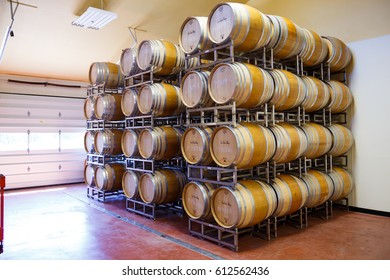 EUGENE, OR - MAY 2, 2015: Barrel Room Detail Of Large Wine Barrels Stacked Together At Sweet Cheeks Winery In Eugene Oregon.