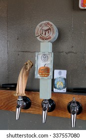 EUGENE, OR - NOVEMBER 4, 2015: Custom Tap Handle At The Startup Craft Brewery Mancave Brewing.