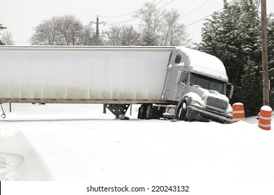 EUGENE, OR, USA -  FEBRUARY, 16, 2014: A Semi Truck Jackknife Accident Into A Ditch During A Winter Snow And Freezing Rain Storm