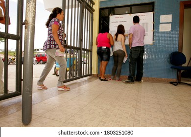 Eunapolis, Bahia / Brazil - November 6, 2010: People Look At Attendance List For Exams Of The National High School Exam - Enem - In The City Of Eunapolis.