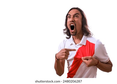 Euphoric Peruvian fan shouts goal and shows his country's coat of arms. Copy space, soccer concept. - Powered by Shutterstock