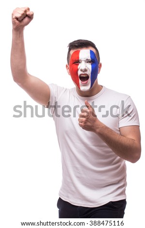 Euphoric scream of France football fan in win game or score of France national  team.  Big smile, scream, Hands over head look at camera  on white background. European  football fans concept.