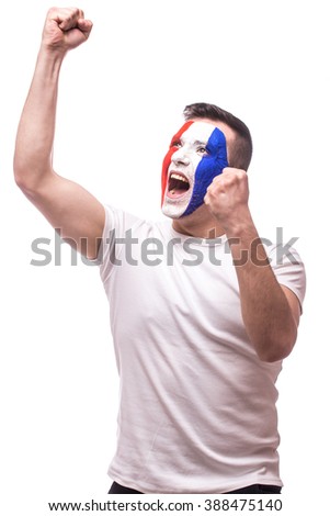 Euphoric scream of France football fan in win game of France national  team.  Big smile, scream, Hands over head on white background. European  football fans concept.