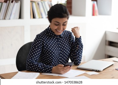 Euphoric Smiling Indian Female Student Received Mail With Good News Or Win Notification. Happy Young Lucky Girl Celebrating High Score Examination Results, Passed Session Or Good Internship Offer.