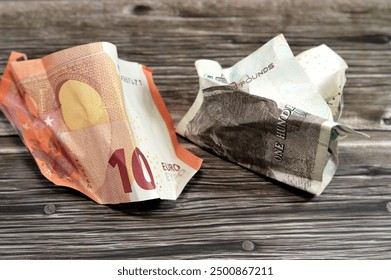 EUR European Euros wrinkled, Crumpled and folded EGP LE Egyptian pounds, money banknote, banking, economic, growth and inflation concept, folded Europe money cash and economy, exchange rate - Powered by Shutterstock