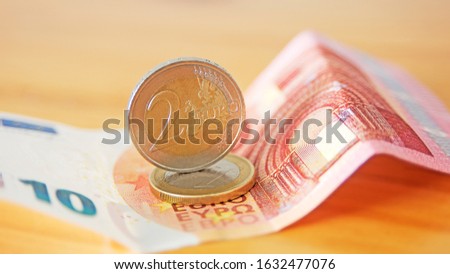 euro bank notes on wooden background