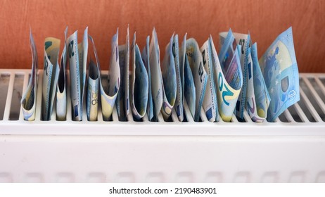 Euro banknotes in central heating radiator, concept of expensive heating costs, close-up. Crisis of energy resources in the world - Shutterstock ID 2190483901