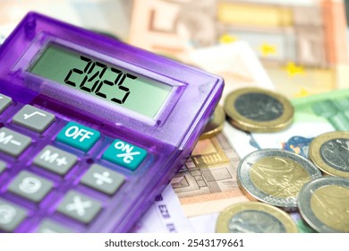 Euro banknotes and coins, calculator and forecast for finances in 2025