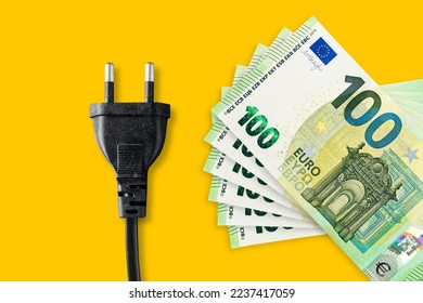 Euro banknotes on a yellow background. Energy crisis and expensive electricity, gas, oil price. Big heating, gas and electricity bill