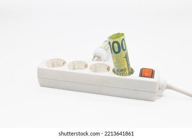 Euro Banknotes Are Stuck In An Electric Power Strip. Concept Of The Increasing Electricity Prices