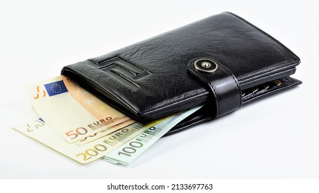 Euro cash and wallet, a means of payment for goods and services. Isolated on a white background. The concept of a financial well-being strategy. Euro cash and wallet, a means of payment for goods and services. Isolated on a white background. The concept of a financial well-being strategy.
