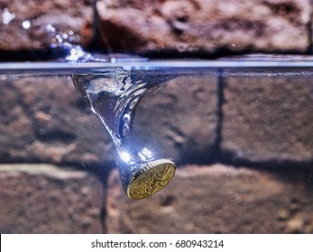 Euro Coin Falling In A Wishing Well.