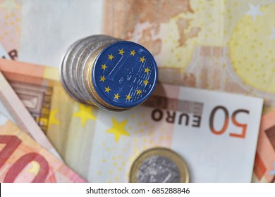 Euro Coin With Flag Of European Union On The Euro Money Banknotes Background. Finance Concept