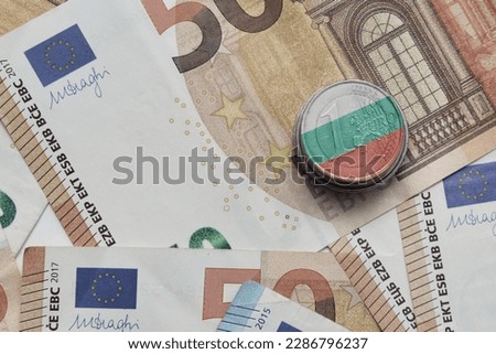 euro coin with national flag of bulgaria on the euro money banknotes background