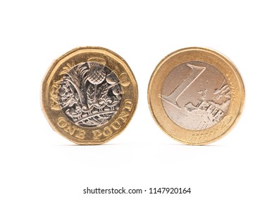 Euro Coin And New Pound Coin Isolated On White Background