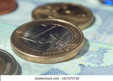 Euro coins and bills of different value. Shallow depth of field
