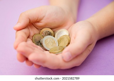 Euro Coins In Kids Hands. Currency Transfer, Investment, Payment, Donation, Gift Concept. Saving Money For The Future, Education, Car, Weddings. 