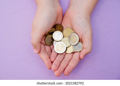 Euro Coins In Kids Hands. Currency Transfer, Investment, Payment, Donation, Gift Concept. Saving Money For The Future, Education, Car, Weddings. 