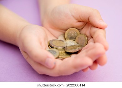 Euro Coins In Kids Hands. Currency Transfer, Investment, Payment, Donation, Gift Concept. Saving Money For The Future, Education, Car, Weddings. 