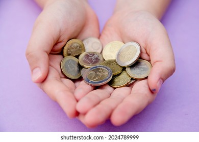 Euro Coins In Kids Hands. Currency Transfer, Investment, Payment, Donation, Gift Concept. Saving Money For The Future, Education, Car, Weddings. 