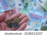 Euro coins notes in hand. Euro Money cash background. Euro Money Banknotes. Euro bills, coins in Crisis of European Union. European Union