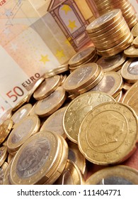Euro coins on banknote money background