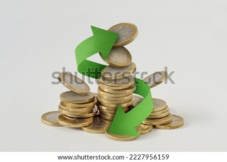 Euro coins stack with circle arrows - Concept of finance, cash back and money circulation