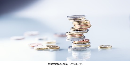 Euro coins stacked on each other in different positions. - Powered by Shutterstock