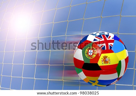 Euro cup soccer ball with flags over a goal's net