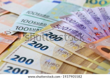 Euro currency banknotes background. European paper money texture with 50, 100, 200 and 500 euros bills.