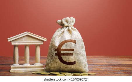 Euro Money Bag And Bank / Government Building. Tax Collection And Budgeting. State Debt. GDP And GNP. Monetary Policy. Support Businesses In Times Of Crisis. Lending Loans, Placing Deposits.