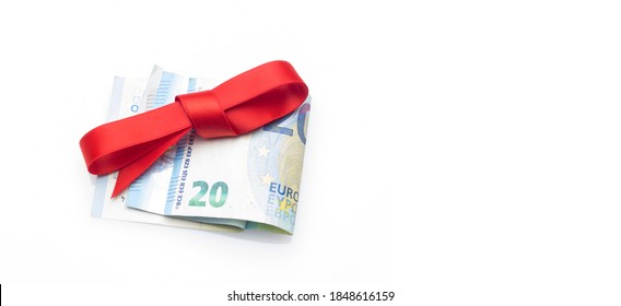 Euro Notes And Coins Decorated With Gift Bows; Give Away Money At Christmas Parties. When You Don't Know What To Give, You Give Money. The Best Gift, Give Money And Let Everyone Buy What They Want.