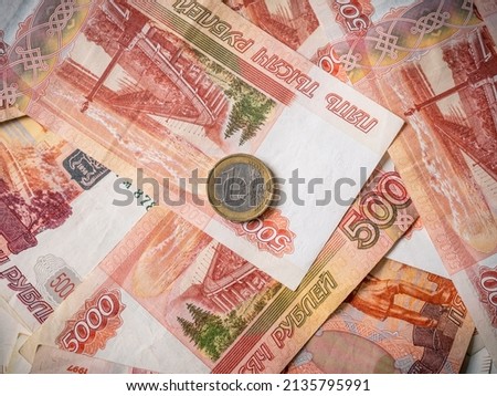 Euro and rouble. Foreign currency exchange. Russia and EU. Economic crisis. Russian money. Investment, business and finance. Emerging markets. Money background. Money in cash. Euro coin on roubles