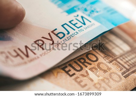 euro and rubles. The concept of currency exchange. Economic crisis, decline of the world economy. Ruble devaluation. The fall of the Russian currency. Currency exchange at the Bank. Foto stock © 