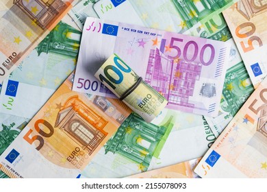 Euro in stationery band on pile of paper banknotes five one hundred and fifty euro. Heap of money - Shutterstock ID 2155078093