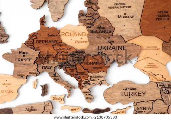Europa on the\
political map. Wooden world map on the wall. Ukraine, Russia,\
Belarus, Poland and other\
countries