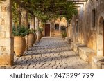 Europe, Greece, Crete, Rethymno. Venetian Baroque, 16th C. Eastern Orthodox Monastery.  The Holy Monastery of Arkadi. Cloister with grape arbor.