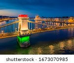 Europe Hungary Budapest Decorated Szechenyi Chain bridge Hungarian parliament building. Danube river