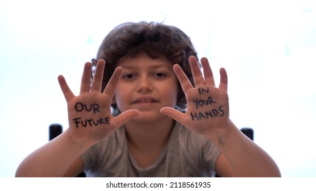 Europe, Italy - 7 Year Old Boy Child  Environmentalist With Written On His Hands Our Future Is In Your Hands - Environmentalist Protest Against Cmilmatic Changes And Global Warming - Youth For Future