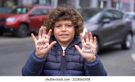 Europe, Italy - 7 Year Old Boy Child  Environmentalist With Written On His Hands Our Future Is In Your Hands - Environmentalist Protest Against Cmilmatic Changes And Global Warming - Youth For Future