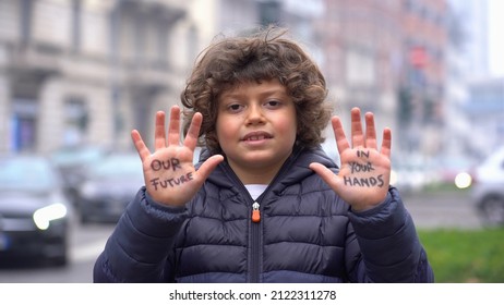 Europe, Italy - 7 Year Old Boy Child  Environmentalist With Written On His Hands Our Future Is In Your Hands - Environmentalist Protest Against Cmilmatic Changes And Global Warming - Youth For Future