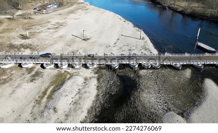 Europe, Italy , Pavia - water emergency and drought aridity - Po Ticino river in shortage of water below the minimum level - climate change and global warming - drone  view Ponte  Chiatte Bereguardo