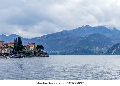 Europe, Italy, Varenna, Lake Como, a large body of water with a mountain in the background - Shutterstock ID 1193999932