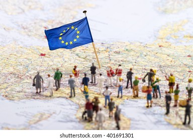 Europe map with European flag and a large group of figures.
