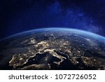 Europe at night viewed from space with city lights showing human activity in Germany, France, Spain, Italy and other countries, 3d rendering of planet Earth, elements from NASA