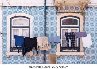 Europe, Portugal, Lisbon. Laundry hanging to dry outsde an old building.